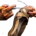 Repair by stitching sole of ladies' shoe